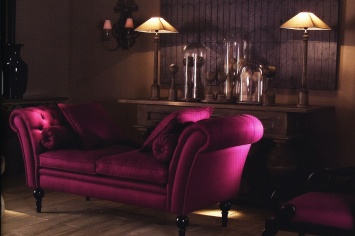 PINK UPHOLSTERED SOFA WITH WOODEN LEGS